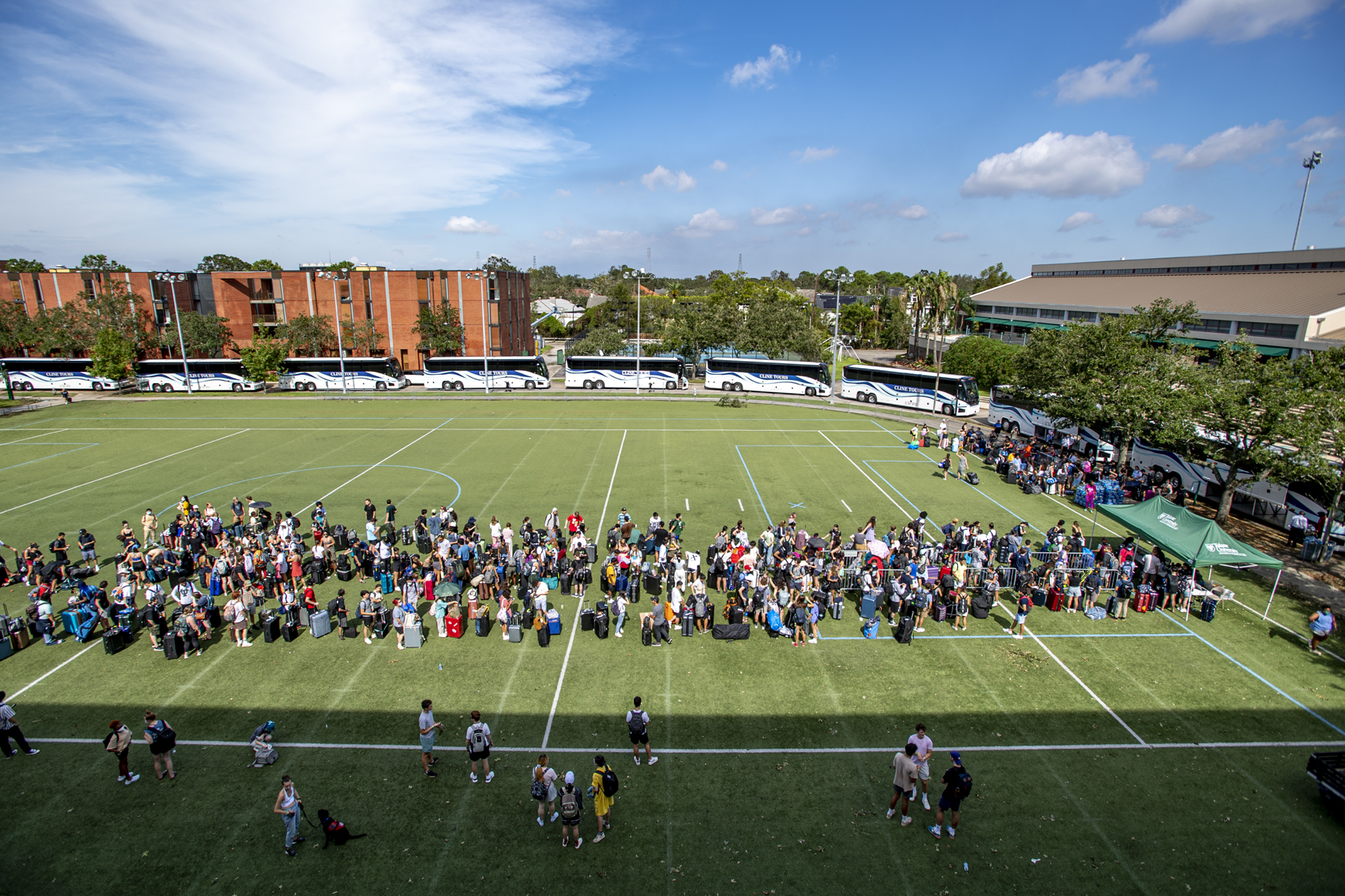 Hurricane Ida Evacuation, August 2021 Tulane students board buses to Houton, TX following the aftermath of Hurricane Ida, August 31,2021. Students lined up on Brown Field along with some of the 35 buses that would shuttle them to Houston hotels to wait for their flights home.